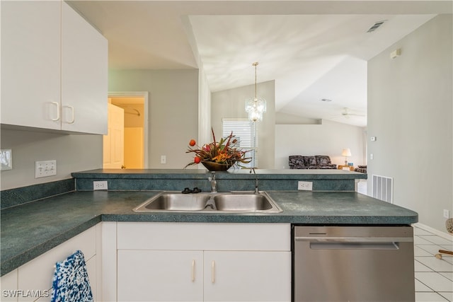 kitchen featuring white cabinetry, lofted ceiling, and dishwasher