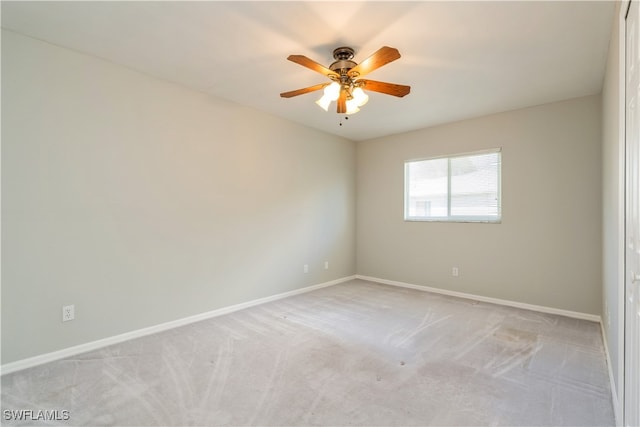 carpeted empty room with ceiling fan