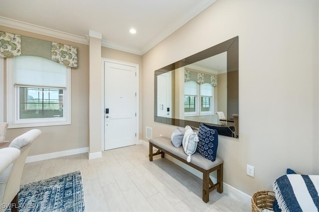 foyer entrance featuring ornamental molding