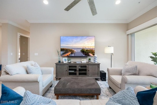 living room with ceiling fan, ornamental molding, and recessed lighting