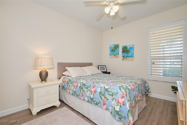 bedroom featuring wood-type flooring and ceiling fan