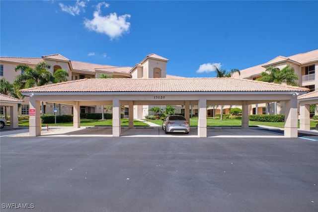 view of parking / parking lot featuring a carport