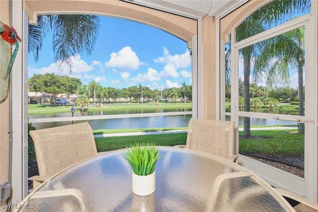 sunroom with a water view