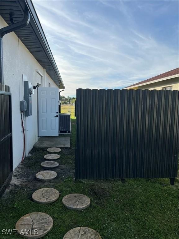 view of yard with central AC unit