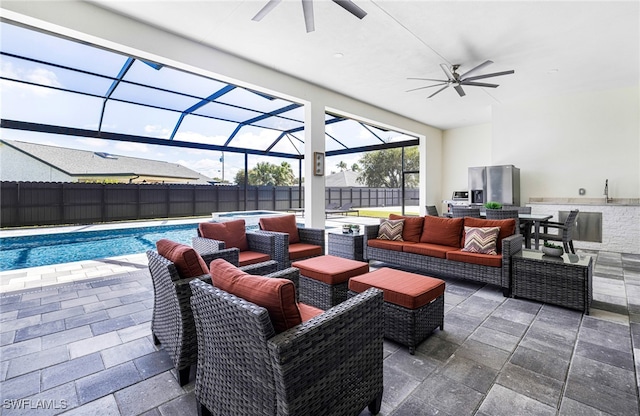 view of patio with a lanai, an outdoor living space, a fenced in pool, and ceiling fan