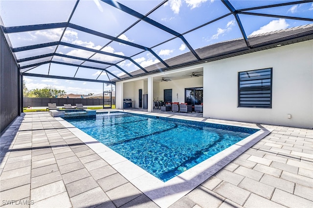 view of pool with a patio, a lanai, an in ground hot tub, and ceiling fan