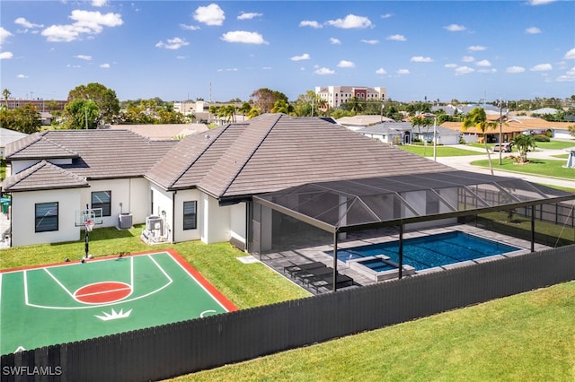 exterior space with a fenced in pool and a yard