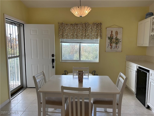 tiled dining area featuring wine cooler and a wealth of natural light