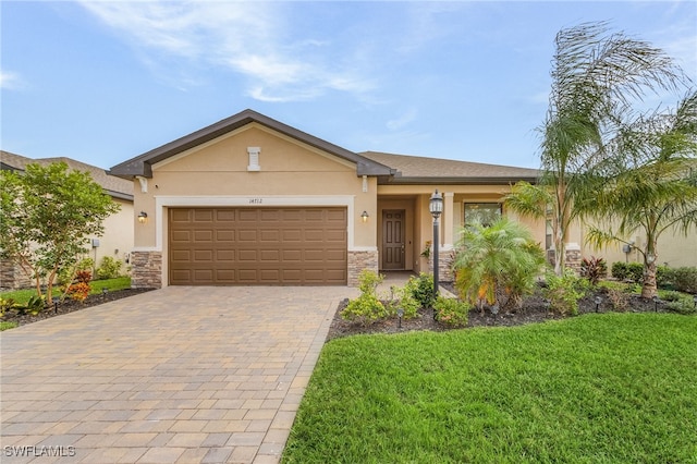 view of front facade featuring a front lawn and a garage