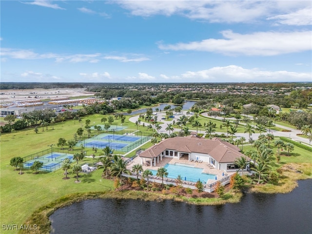 birds eye view of property with a water view