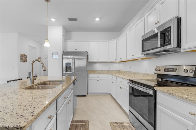 kitchen featuring white cabinetry, stainless steel appliances, and sink