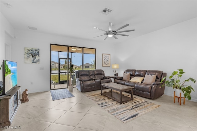 tiled living room featuring ceiling fan