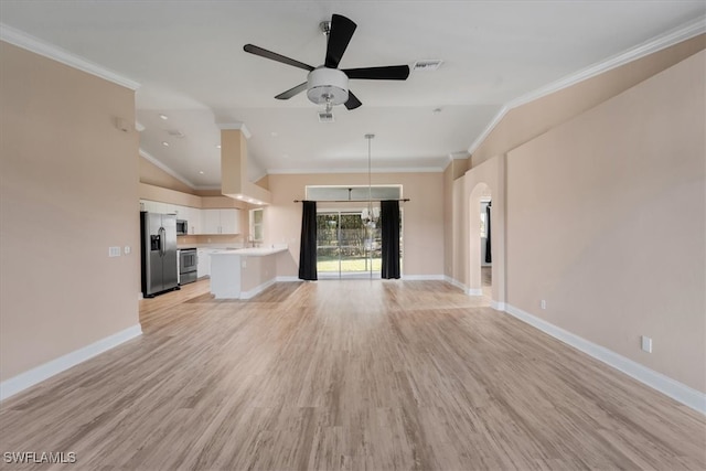 unfurnished living room featuring ceiling fan, light wood-type flooring, ornamental molding, and vaulted ceiling