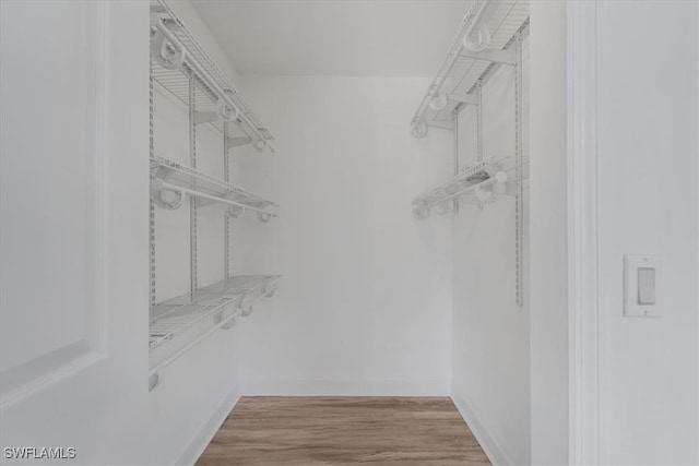 walk in closet featuring light wood-type flooring