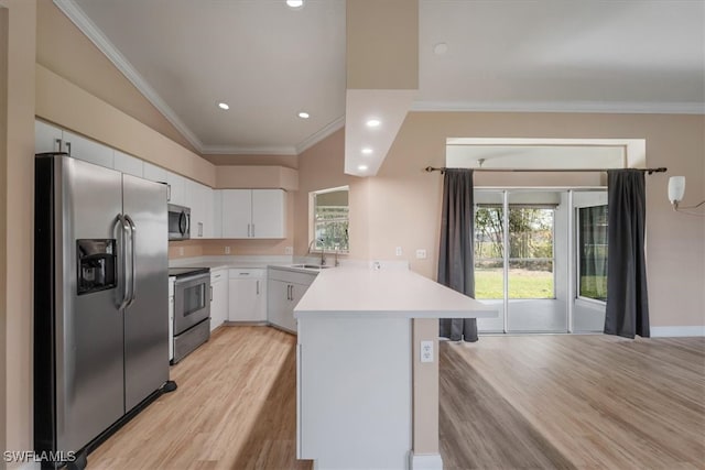 kitchen with sink, kitchen peninsula, light wood-type flooring, appliances with stainless steel finishes, and white cabinetry