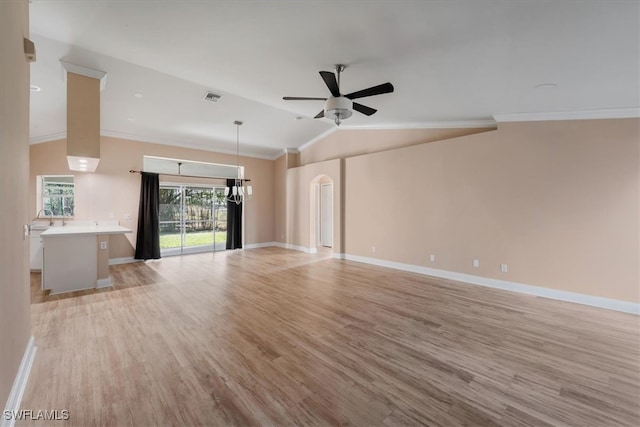 unfurnished living room featuring ceiling fan, light wood-type flooring, crown molding, and lofted ceiling