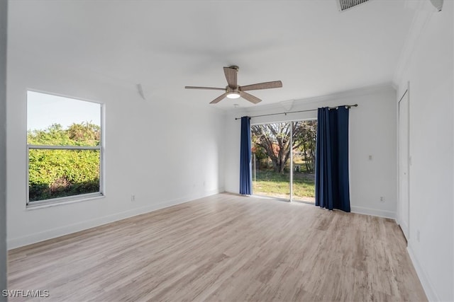 unfurnished room featuring light wood-type flooring, ceiling fan, and crown molding