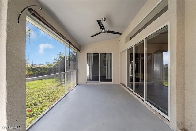 unfurnished sunroom with ceiling fan and lofted ceiling