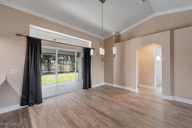 unfurnished dining area with crown molding, light hardwood / wood-style flooring, lofted ceiling, and a notable chandelier