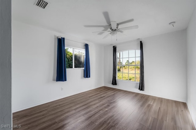 empty room featuring ceiling fan and hardwood / wood-style flooring