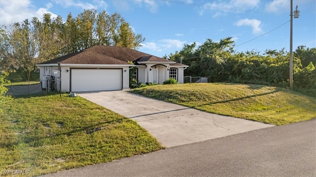 ranch-style house with a front yard and a garage