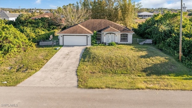 ranch-style home featuring a front yard and a garage