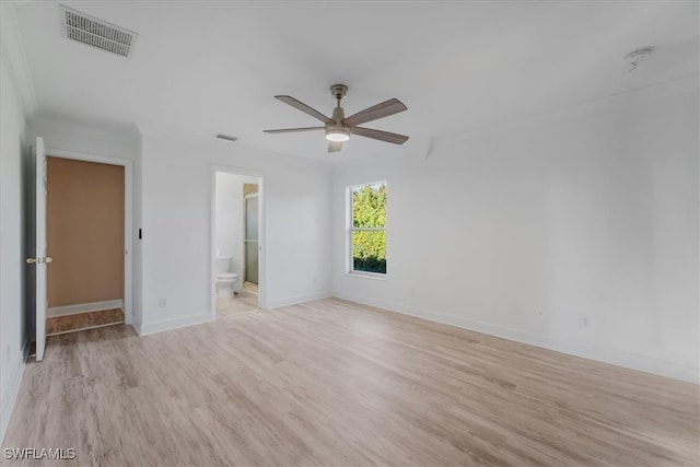 unfurnished bedroom featuring light hardwood / wood-style floors, ensuite bath, and ceiling fan