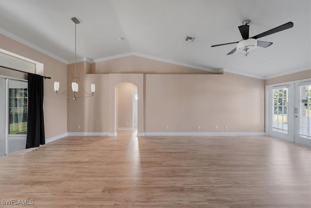 unfurnished room with lofted ceiling, light hardwood / wood-style flooring, and french doors