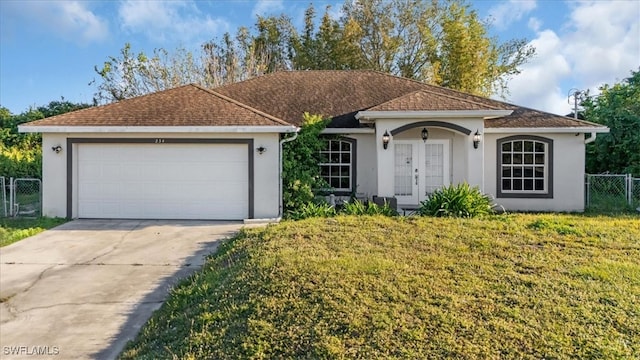 single story home featuring a front lawn and a garage