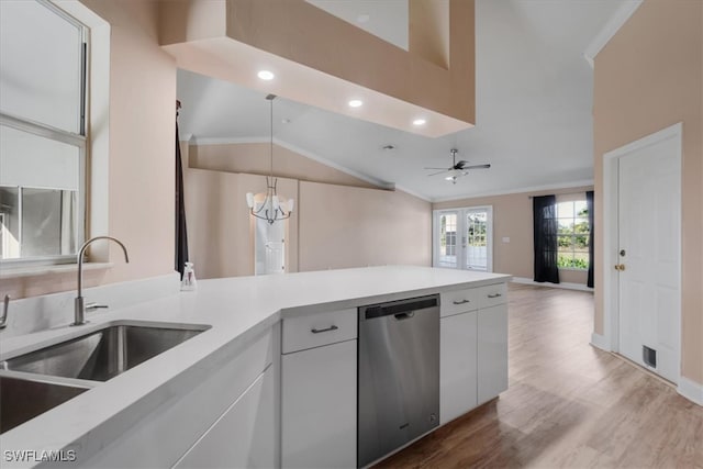 kitchen featuring sink, hanging light fixtures, stainless steel dishwasher, white cabinets, and ceiling fan with notable chandelier