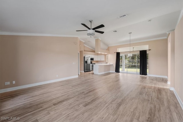 unfurnished living room with crown molding, light hardwood / wood-style flooring, ceiling fan with notable chandelier, and vaulted ceiling