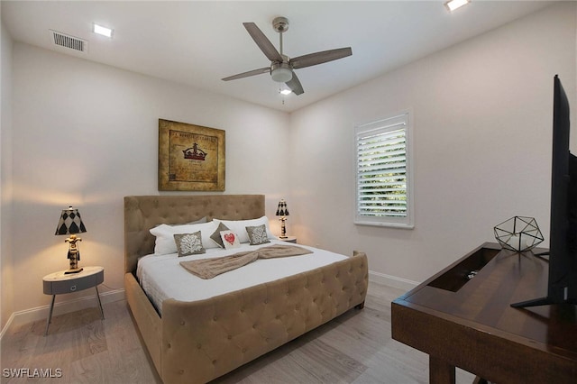 bedroom with light wood-type flooring and ceiling fan