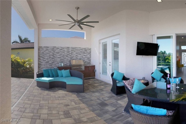 view of patio featuring outdoor lounge area, grilling area, and ceiling fan