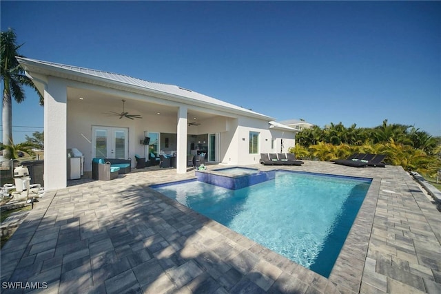 view of swimming pool with an in ground hot tub, ceiling fan, and a patio