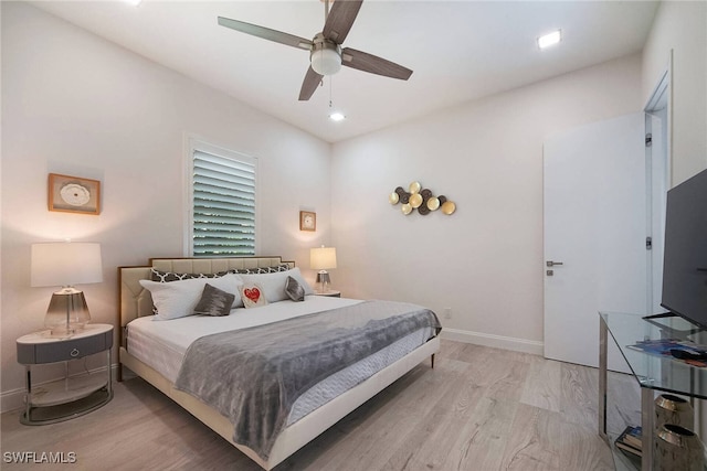 bedroom featuring ceiling fan and light wood-type flooring