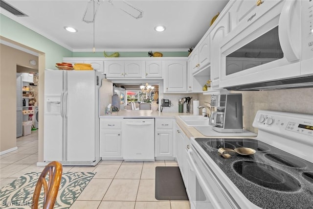 kitchen with white appliances, crown molding, sink, light tile patterned floors, and white cabinets