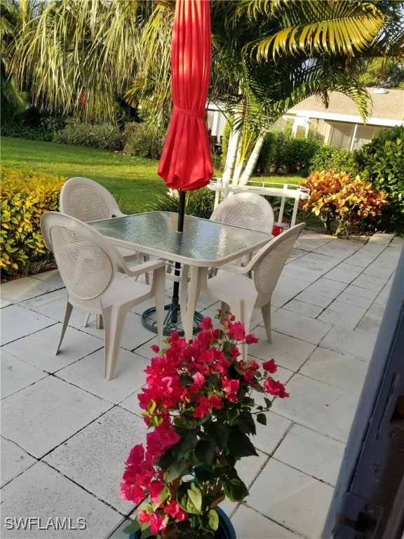 39 Glades Blvd Unit 1, Naples, FL 34112 - view of patio / terrace with outdoor dining area