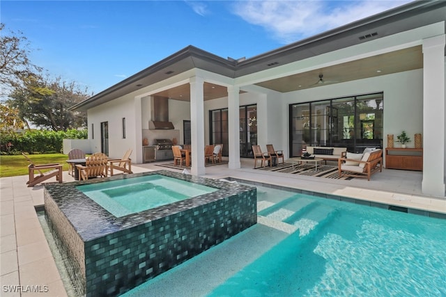 view of pool featuring an in ground hot tub, ceiling fan, a patio area, and an outdoor hangout area