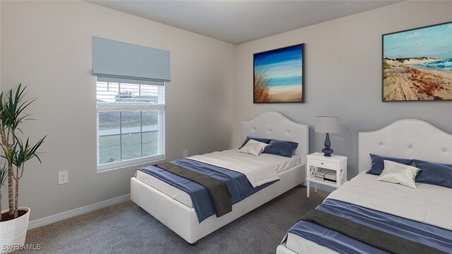 bedroom featuring dark carpet