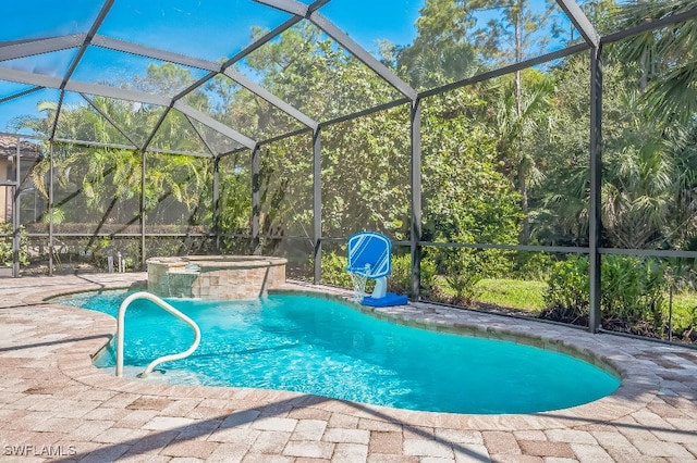 view of pool with an in ground hot tub, pool water feature, a patio area, and a lanai