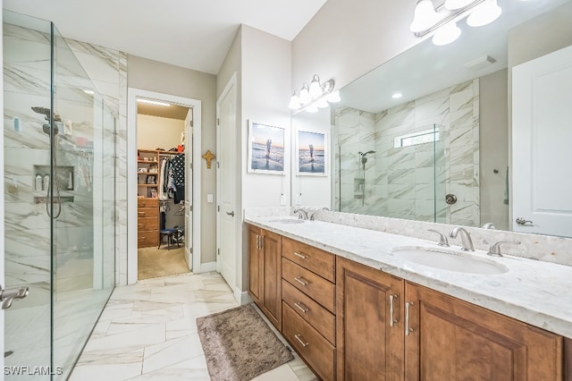 bathroom featuring vanity and an enclosed shower