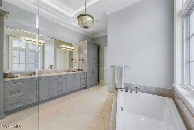 bathroom featuring double vanity, crown molding, a sink, and a bath