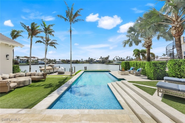 view of pool with a water view and a patio area