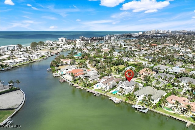 bird's eye view featuring a water view and a city view