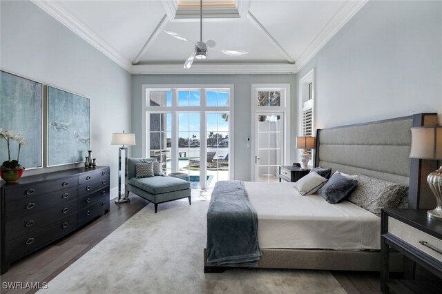 bedroom featuring access to exterior, crown molding, high vaulted ceiling, and wood finished floors