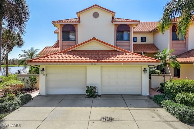 mediterranean / spanish house featuring a garage