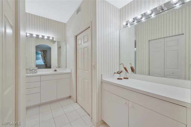 bathroom featuring tile patterned flooring and vanity