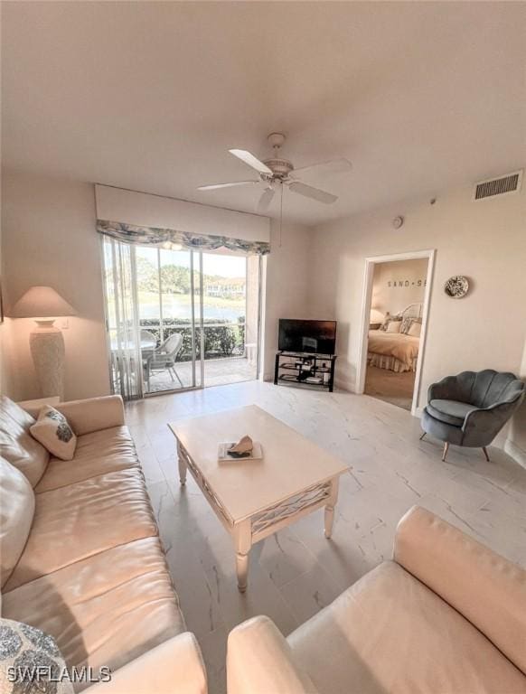 living room featuring ceiling fan