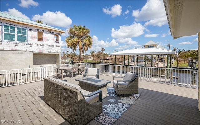 deck featuring a water view and a gazebo