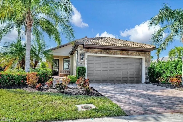 mediterranean / spanish house with a garage